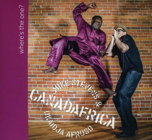 CD cover featuring two men in dynamic poses against a brick wall.