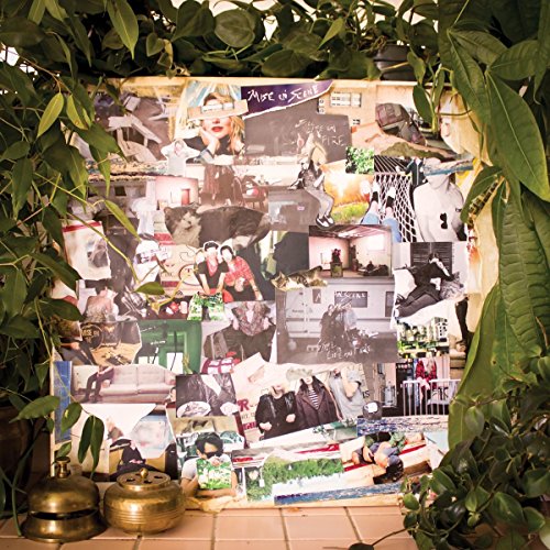 CD cover collage of black and white photos framed by greenery.