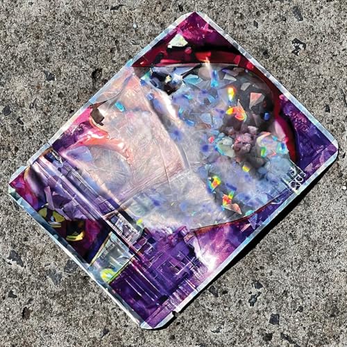 Vinyl record cover with abstract, colorful, fractured imagery on asphalt.