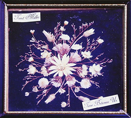 CD cover with pressed flowers and text "Trent Miller - Time Between Us".