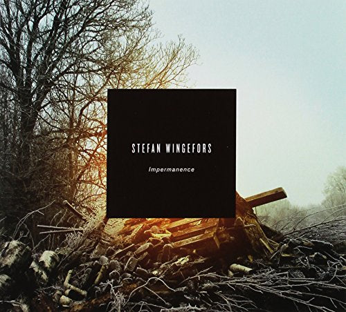 CD cover with black text over a blurred, wintry forest scene.