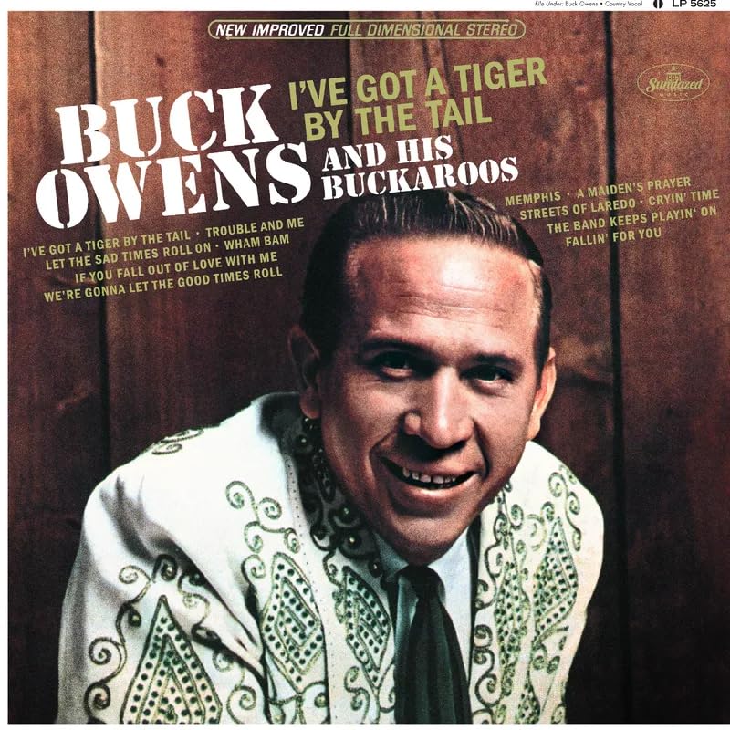 Album cover for Buck Owens’ “I’ve Got A Tiger By The Tail” with portrait.