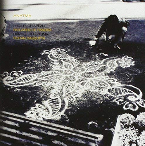 CD cover: person drawing a large, ornate white design on pavement.