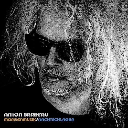 Black and white portrait of Anton Barbeau with sunglasses, album title below.