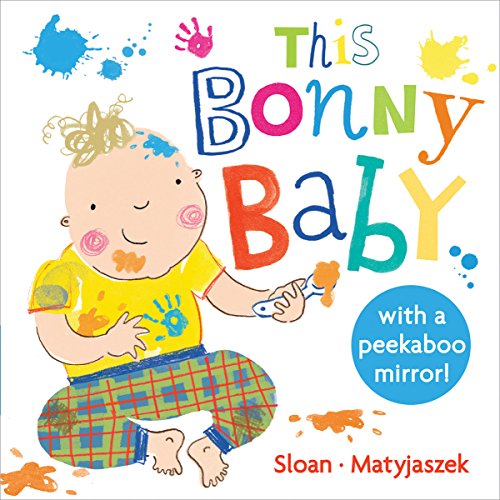 Baby's face in a mirror with Scottish-themed background and decorative elements.