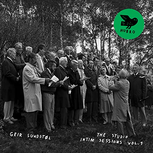 Black and white photo of a large choir group with album title text.