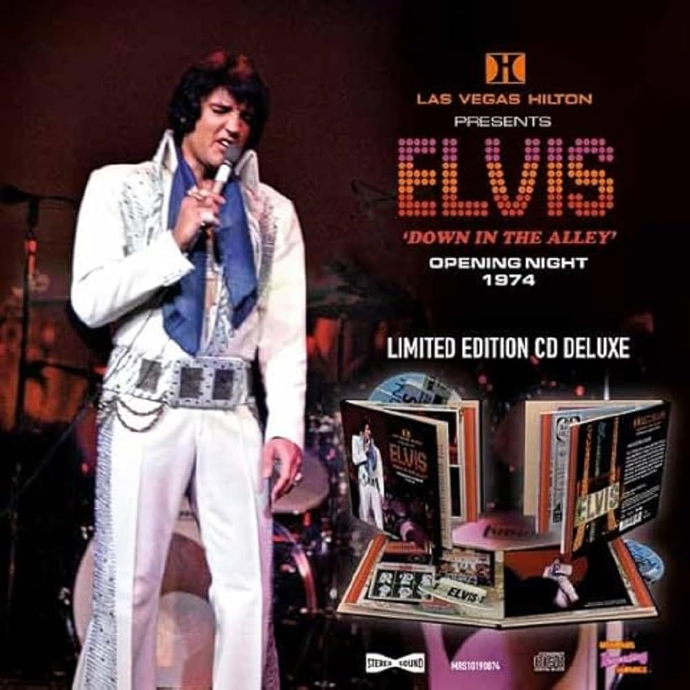 Elvis Presley in white jumpsuit performing on stage, with CD packaging.
