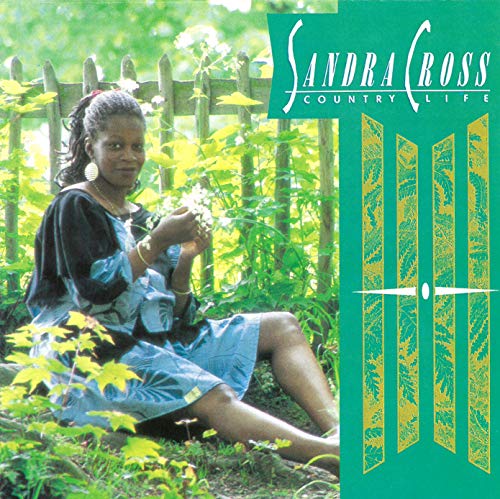 Sandra Ross album cover, woman seated in a rural garden setting.