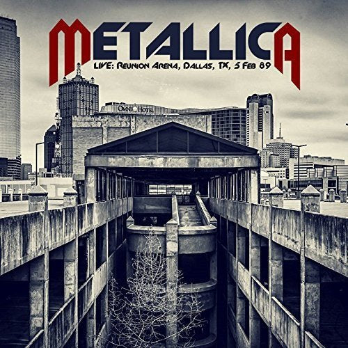 Metallica live album cover featuring a grayscale cityscape and arena.