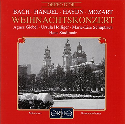 Red CD cover with a snowy winter scene of a European cathedral.