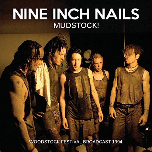 Nine Inch Nails band members covered in mud, Woodstock 1994 CD cover.