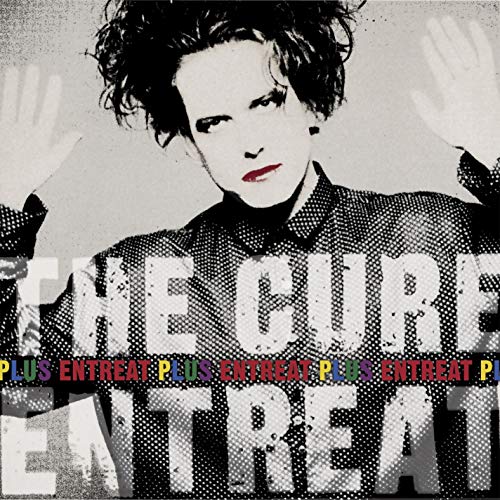 Robert Smith of The Cure on album cover with hand graphic.
