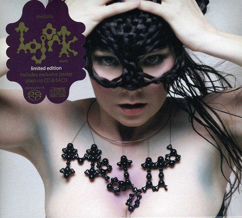 Bjork wearing a black braided mask and a molecular-style necklace on a CD cover.