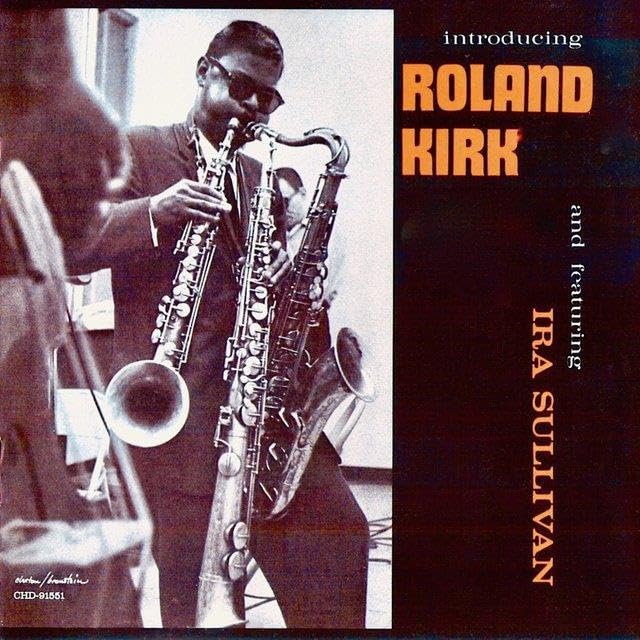Roland Kirk playing multiple saxophones on a vintage album cover.