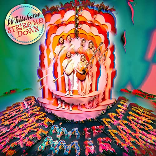CD cover featuring a band on a colorful, psychedelic, tiered stage with wavy patterns.