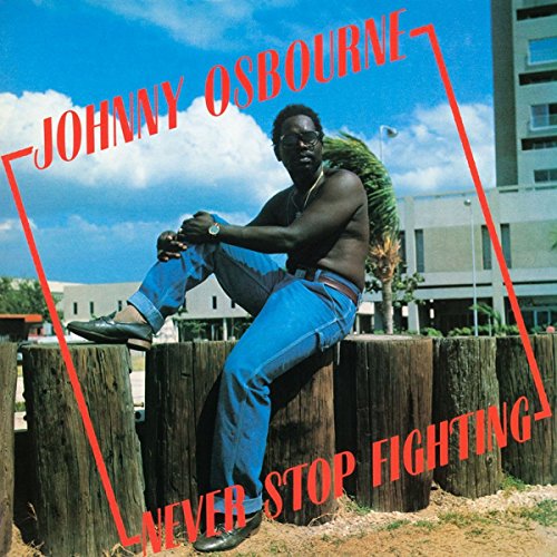 Johnny Osbourne album cover: man in jeans sitting on wooden posts.