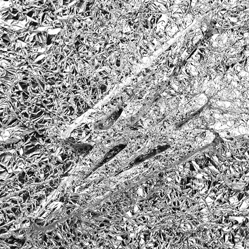 Silver foil texture with dark linear patterns, album cover art.