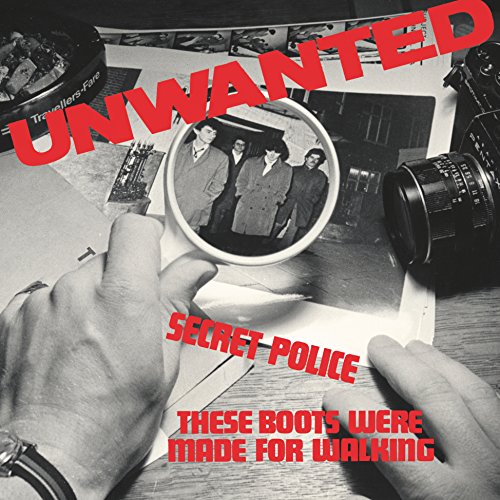 Black and white vinyl record cover featuring a group photo and red text.