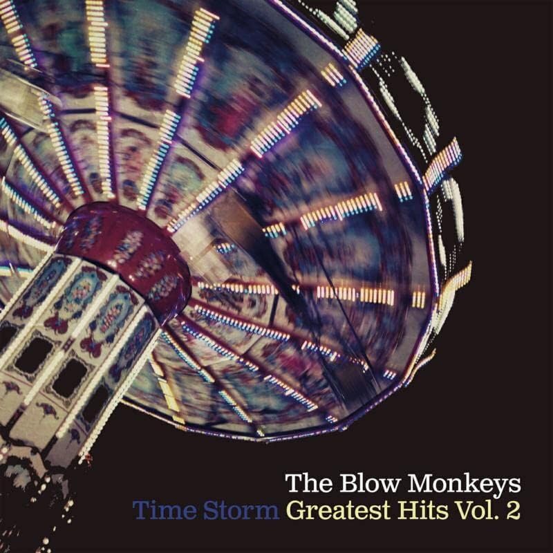 Album cover for The Blow Monkeys’ “Time Storm” featuring a blurred carnival ride.