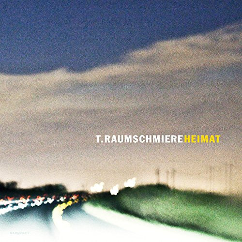 CD cover for T. Raumschmiereās āHeimatā with blurred highway lights.