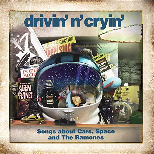 CD cover: astronaut helmet with starry sky, toys, and band name.