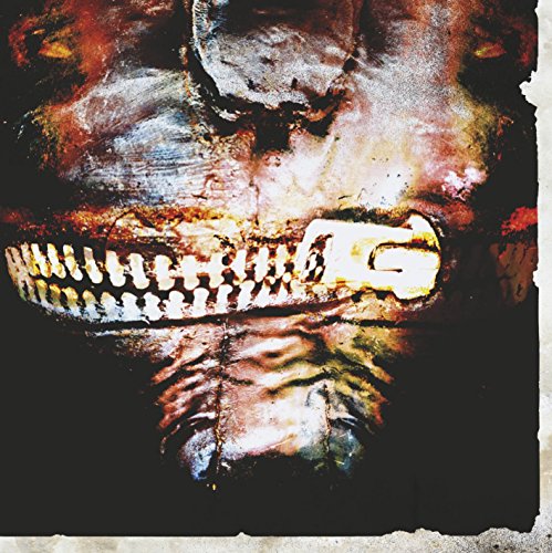 Slipknot album cover: stitched face with open mouth and golden teeth.