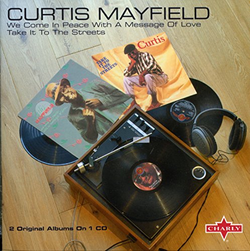 Curtis Mayfield CD with vinyl records, headphones, and a turntable.