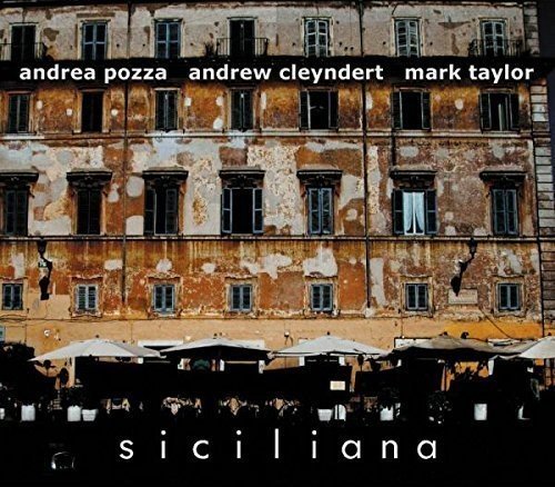 CD cover: weathered building facade with black text and umbrellas below.