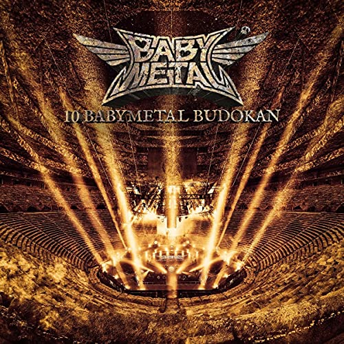 Babymetal album cover: concert stage with lights and audience seating.
