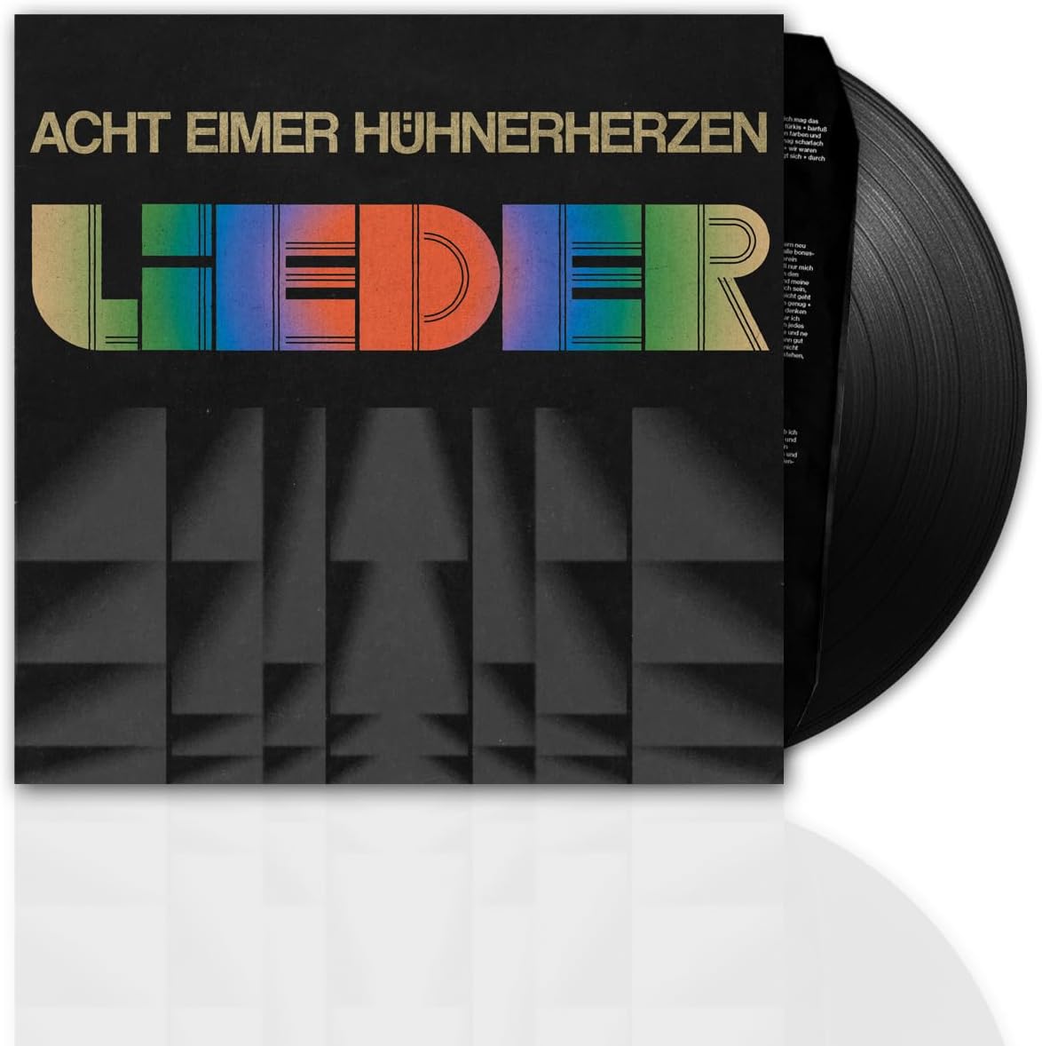Vinyl record with colorful text reading "Acht Eimer Hühnerherzen Lieder".