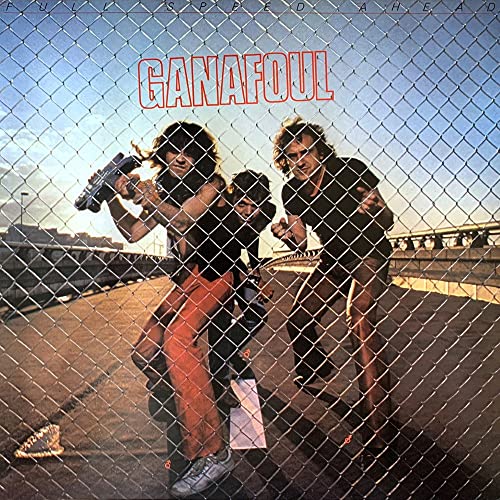 CD cover: band members with instruments in front of chain-link fence.