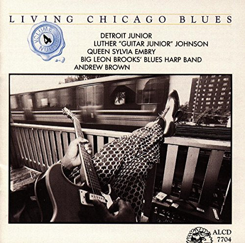 CD cover for "Living Chicago Blues 4" featuring a musician and guitar.