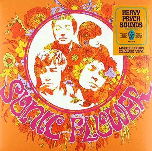 Vinyl record cover with psychedelic floral design and portrait.