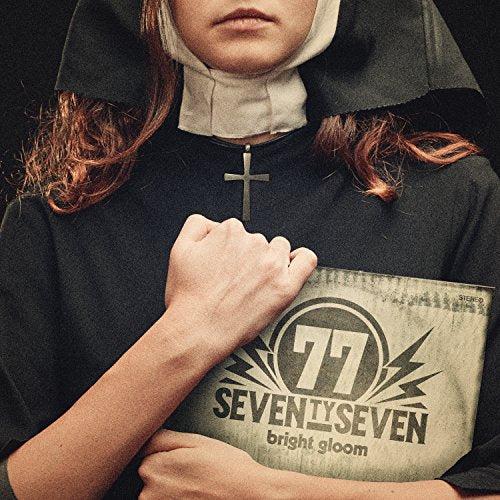 Nun in black habit with fist raised, album cover visible.