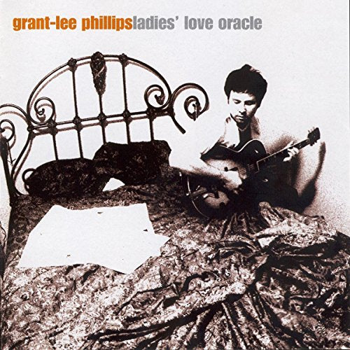 Grant Lee Phillips album cover with a man and ornate bed.