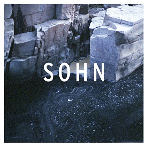 Sohn album cover: rocky coastline with large white text "SOHN".