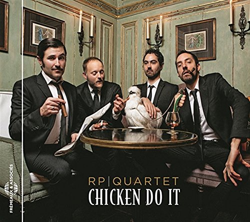 Four men in suits with a white chicken at a table.