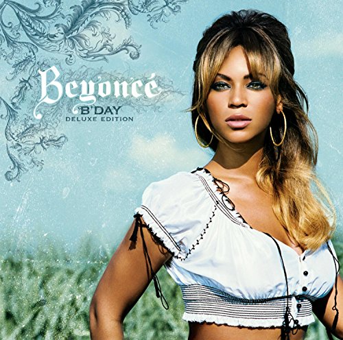 Beyoncé on the B'Day album cover wearing a white top against a blue background.