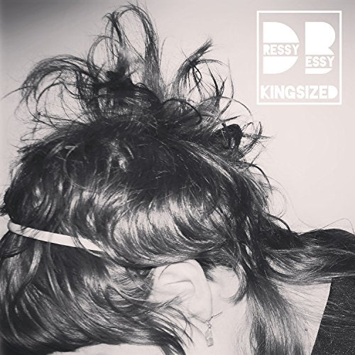 Black and white album cover featuring the back of a woman’s head.
