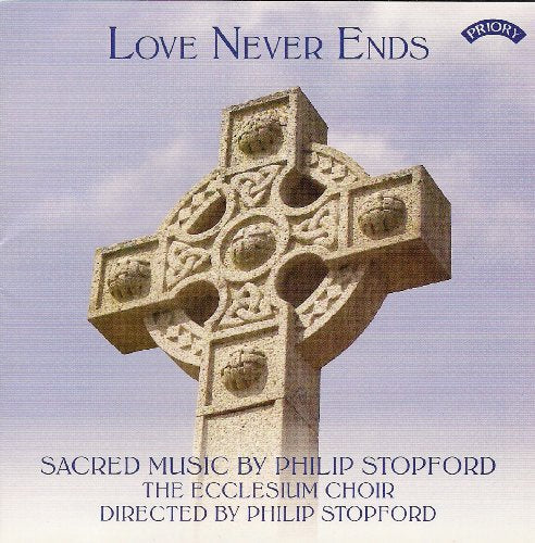 CD cover featuring a stone Celtic cross against a blue sky.