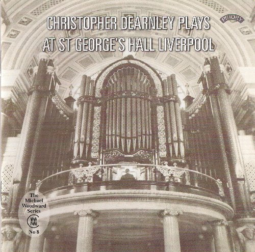 Black and white photograph of a large pipe organ in a hall.