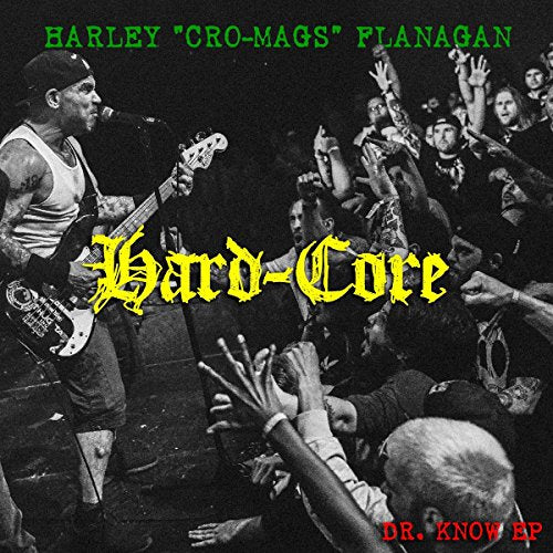Harley Flanagan playing bass guitar onstage with a crowd, album cover.