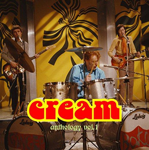 Cream band performing, album cover with red "Cream" text and drums.