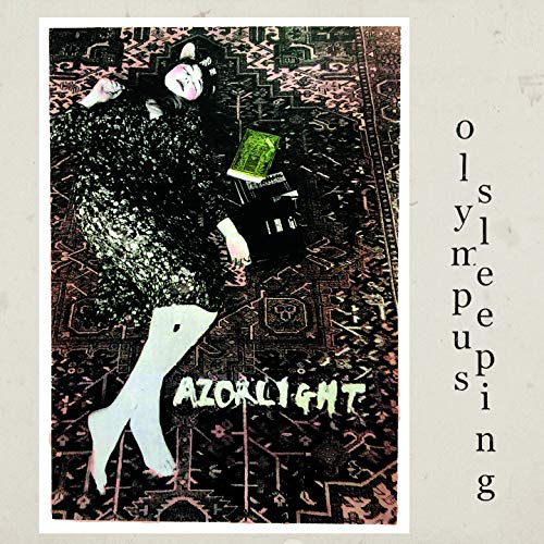 Album cover for Razorlight’s “Olympus Sleeping” featuring a reclining figure.
