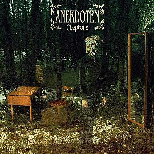 Album cover: person with animal mask in a dark forest scene.
