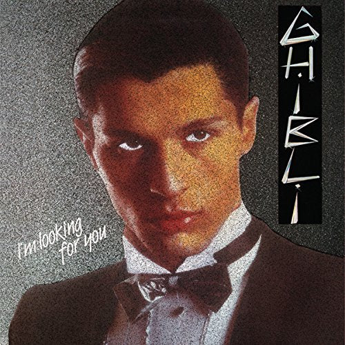 Ghibli album cover featuring a man in a suit, looking intently forward.