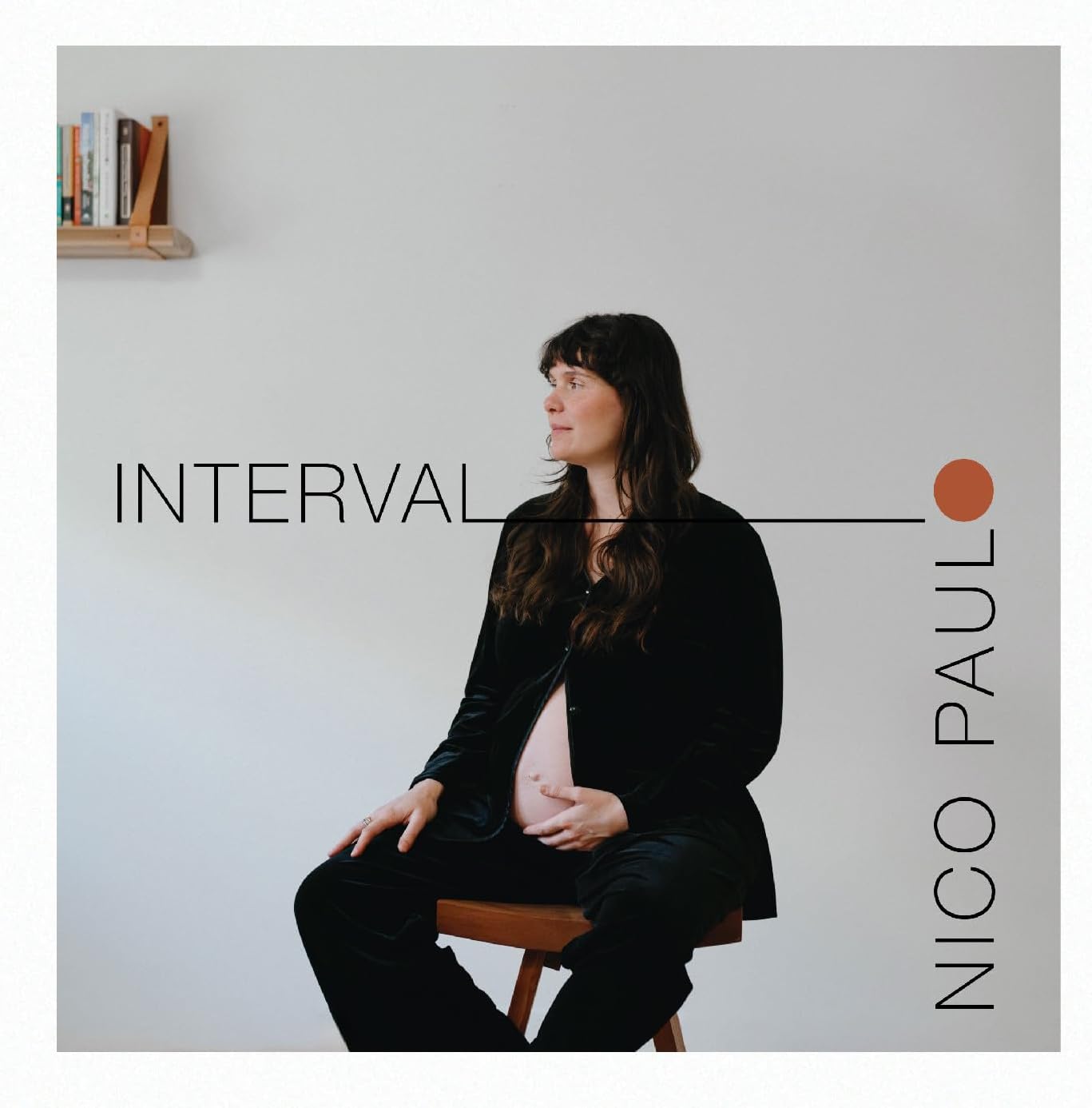 Album cover: woman seated, text āINTERVALā and āNICO PAULOā visible.