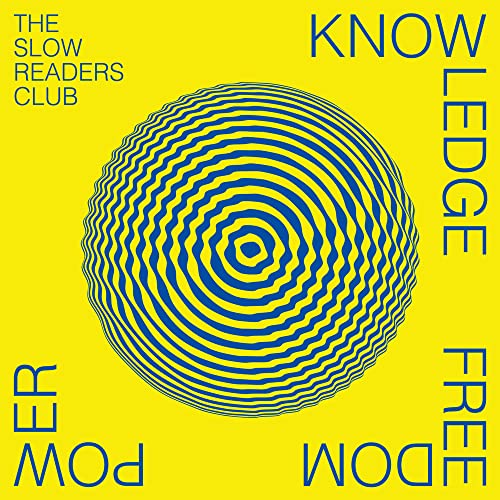 Yellow album cover with blue concentric circles and band/title text.