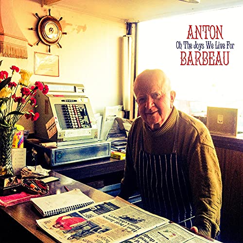 CD cover featuring a smiling older man in a sweater and apron.