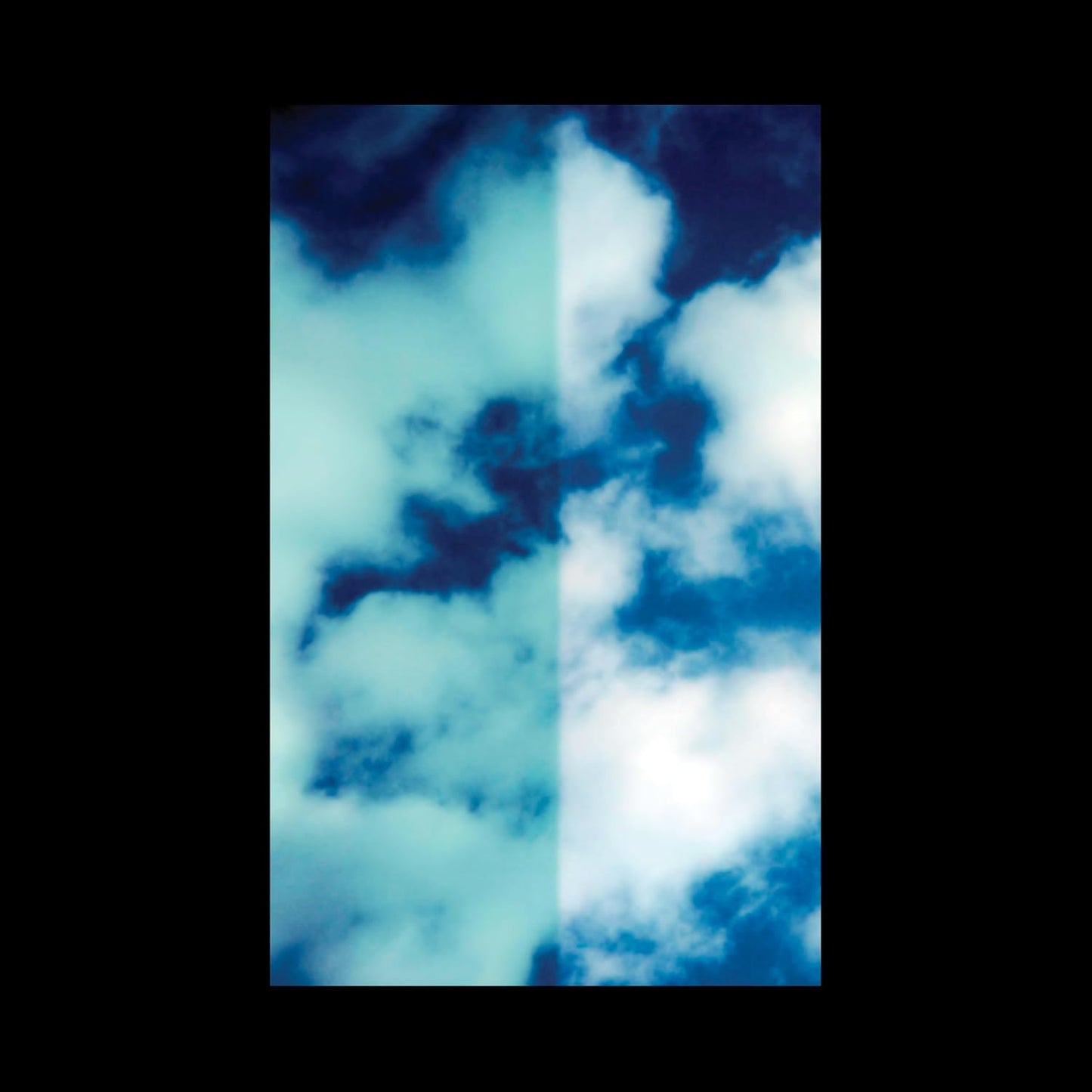 Abstract album cover featuring blurred, divided blue and white clouds.